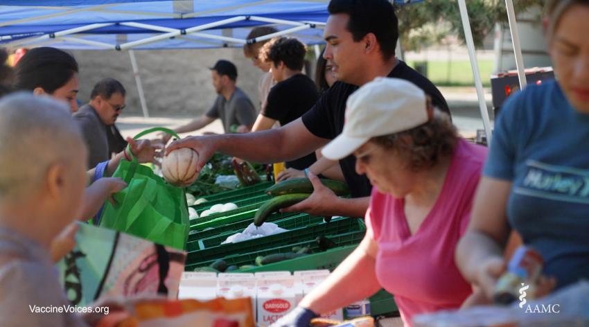 Community members in Spokane, Washington are shown provided fresh produce at El Mercadito.